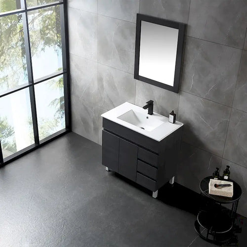 Meuble-lavabo autoportant de 32 po en MDF noir avec lavabo intégré en céramique, une porte et trois tiroirs